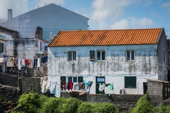 Houses with laundry hanging in Azores, Portugal 4K