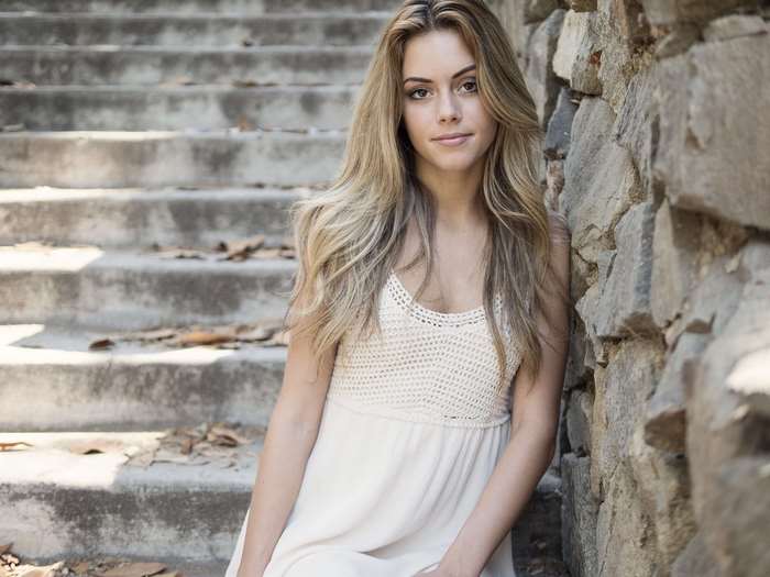 Woman in white dress on stone stairs 4K