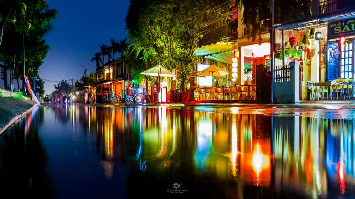 Night street with reflections in water
