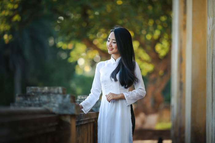 Young Vietnamese Woman in Traditional White Dress 4K
