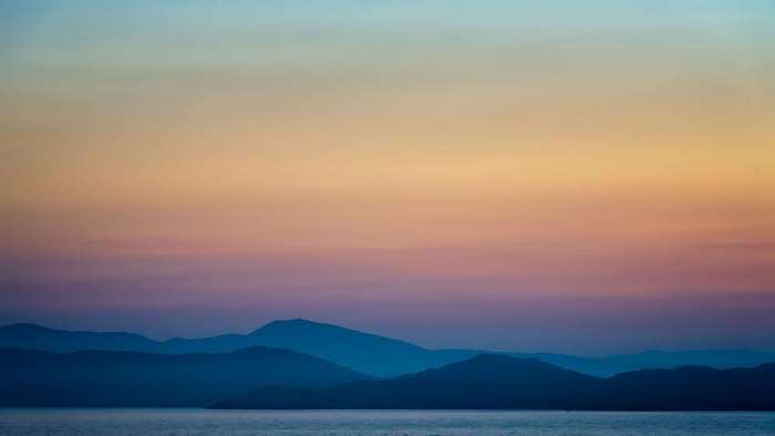 Mountains and sea at sunset 4K
