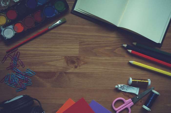 Art supplies on a wooden surface