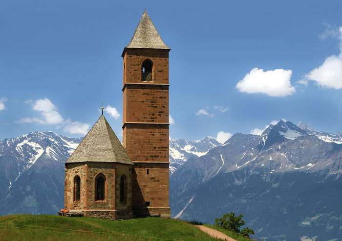 Church and bell tower in the Dolomites, South Tyrol, Italy