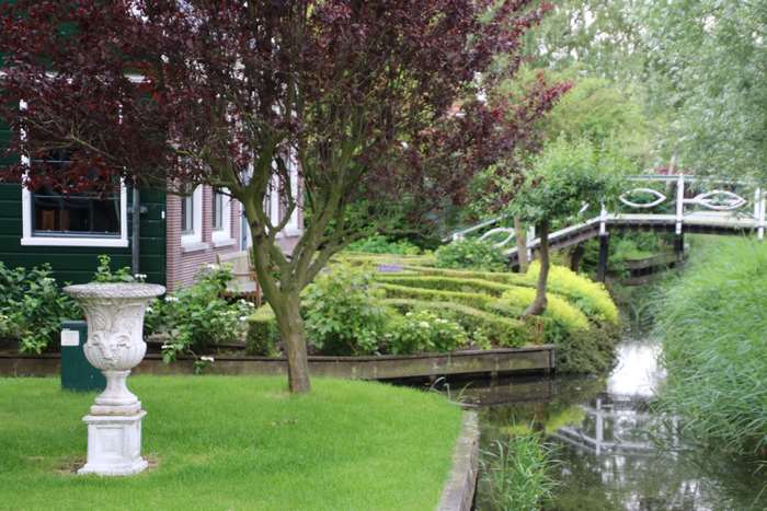 Decorative garden with a bridge over a stream in Holland