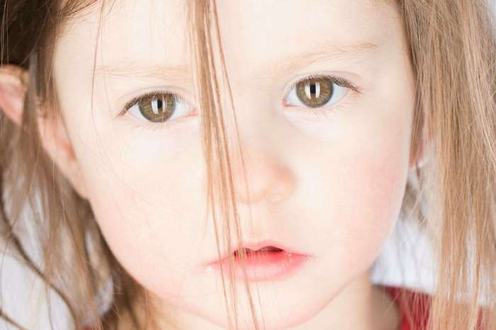 Close-up portrait of a young Caucasian girl