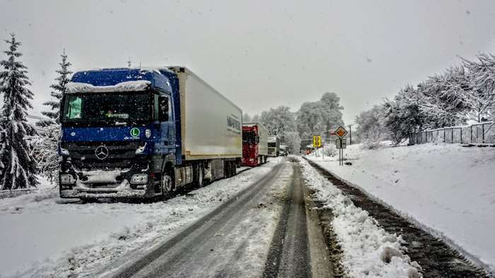 Blue Mercedes Actros truck in snow