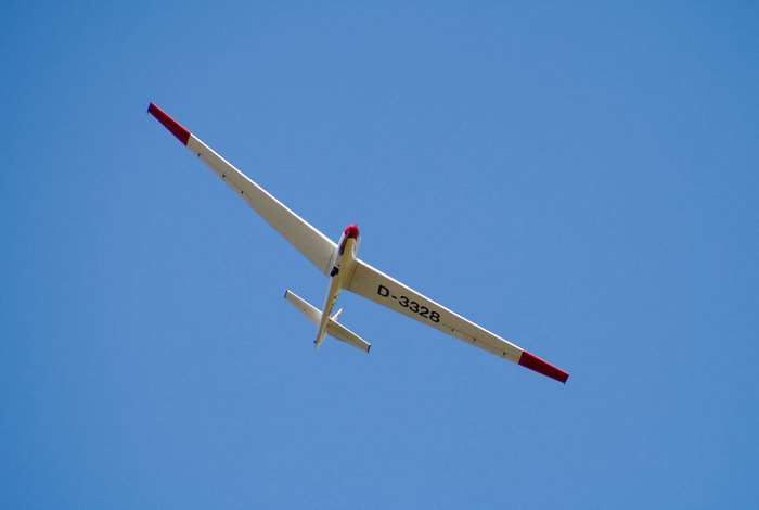 Glider D-3328 flying in a clear blue sky