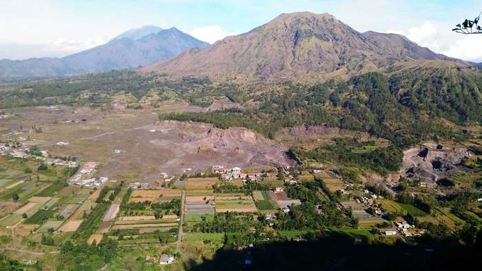 Aerial view of a village and mountains