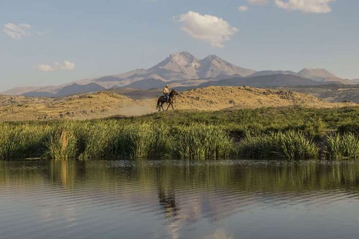 Horse rider near Erciyes mountain in Anatolia, Turkey