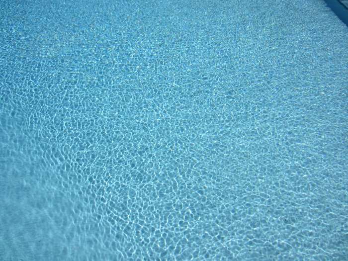 Blue swimming pool water with ripples 4K