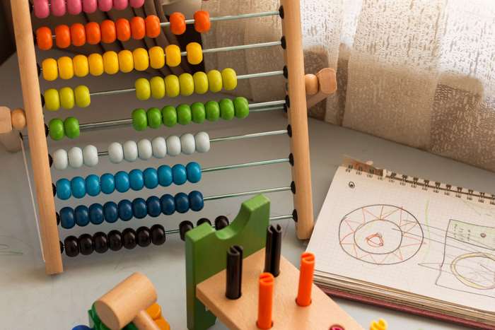 Wooden abacus and children's toys with notebook