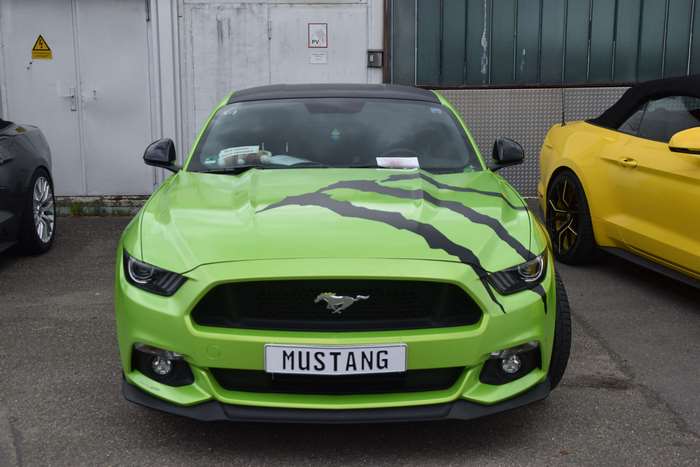 Green Ford Mustang GT with black stripes
