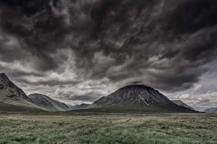 Stormy clouds over Scottish Highlands mountains