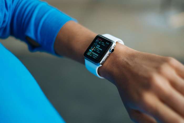 Person wearing a white Apple Watch
