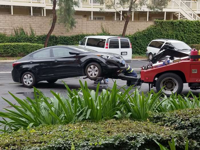 Hyundai Elantra being towed by a tow truck