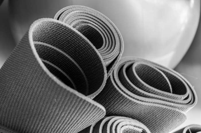 Rolled up yoga mats in a close-up shot