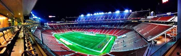 Panoramic view of a football stadium at night
