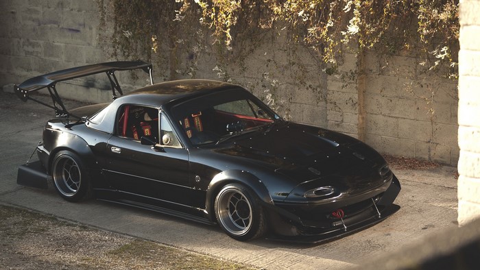 Black Mazda MX-5 Miata with Aerodynamic Modifications