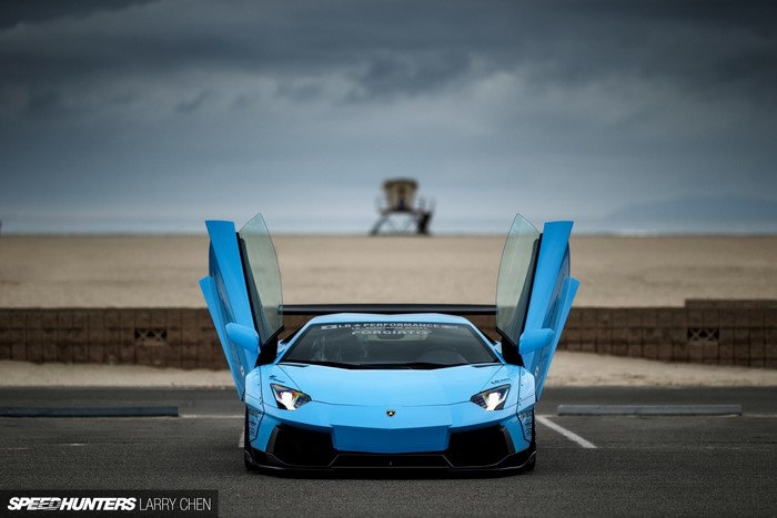 Blue Lamborghini Aventador with Doors Open at Beach
