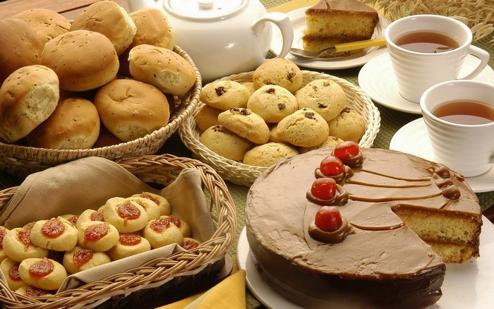 Tea, pastries, cookies, and cake on a table