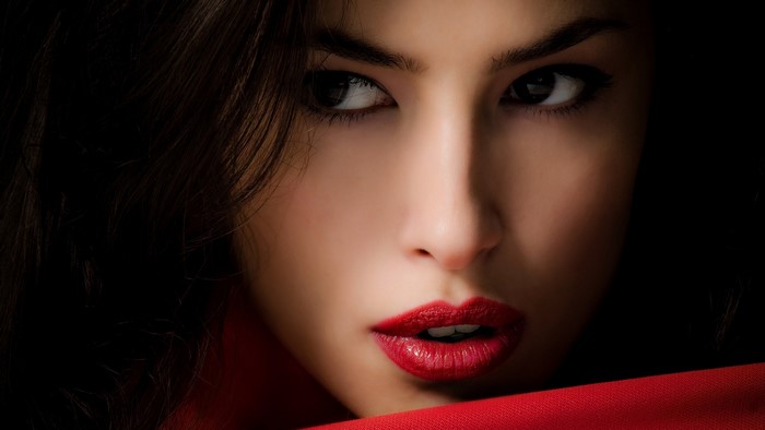 Woman with red lipstick and dark hair