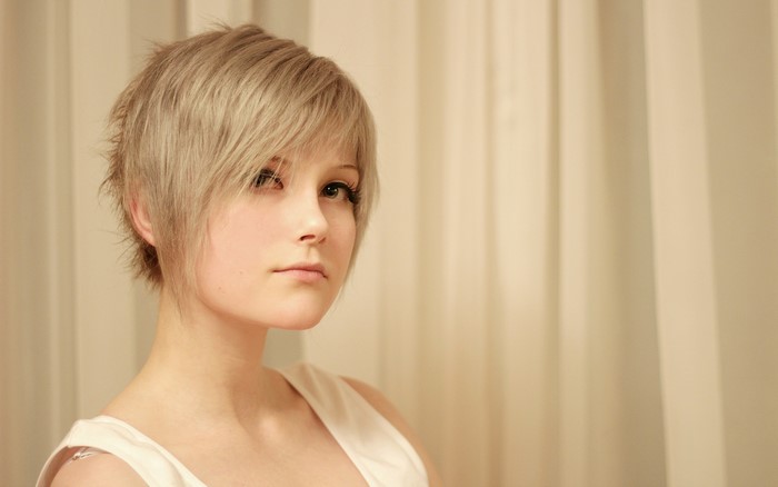 Girl with short blonde hair in profile