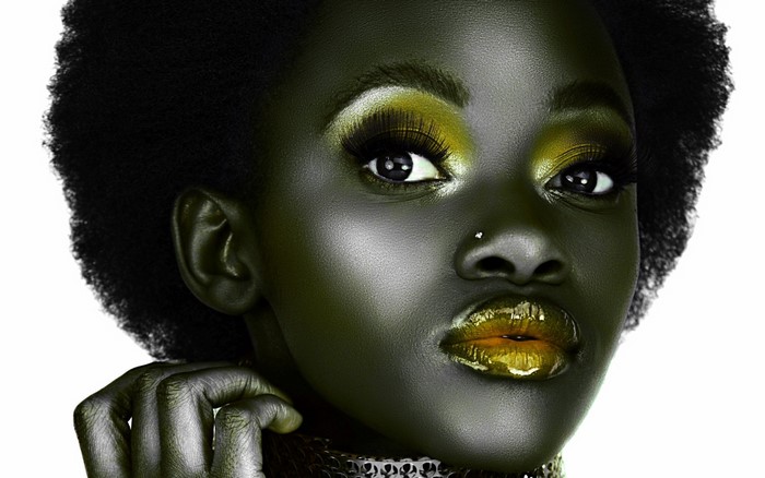 Woman with creative makeup and afro hairstyle