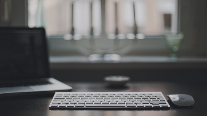Laptop, Keyboard, Mouse, and Window on Desk