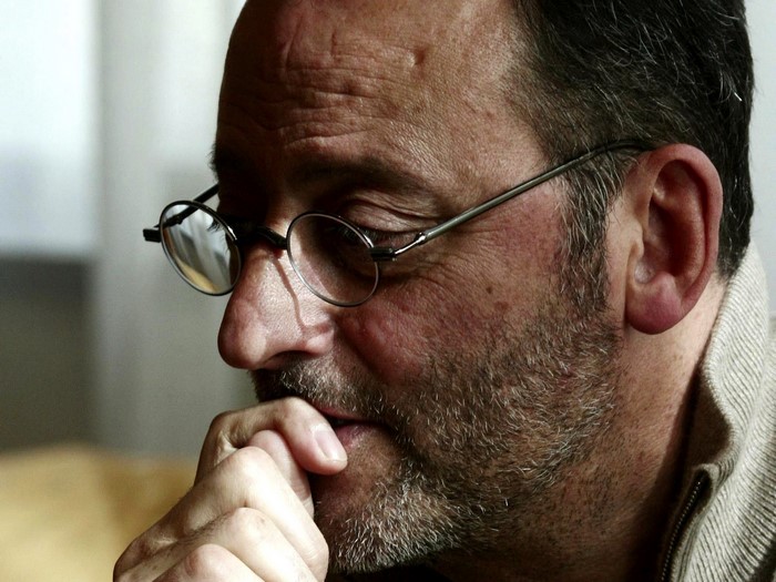 Jean Reno wearing glasses and a beard