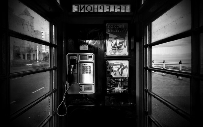 Black and white image of a telephone booth