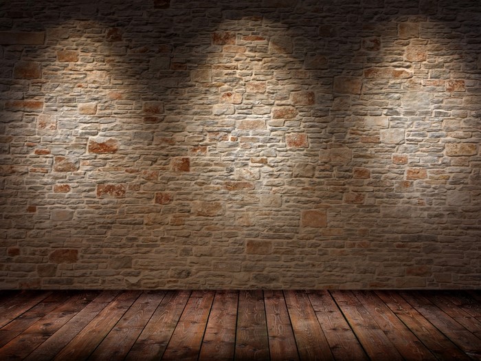 Stone wall and wooden floor with spotlights