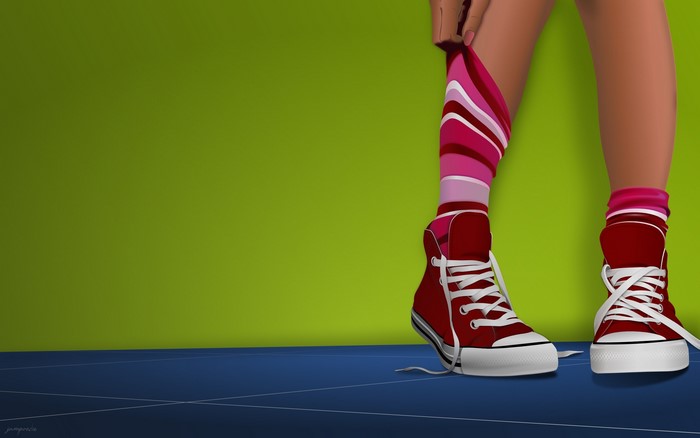 Person putting on striped socks and red sneakers