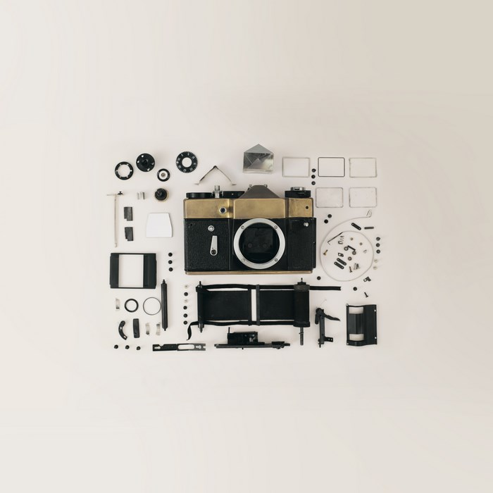 Vintage camera disassembled into parts and components