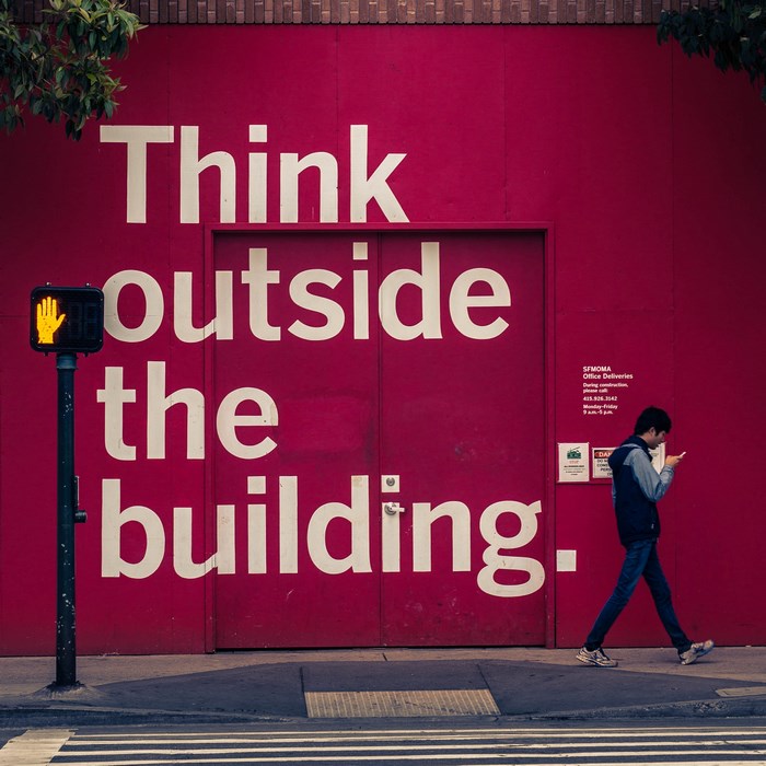 SFMOMA Office Deliveries sign on a red wall