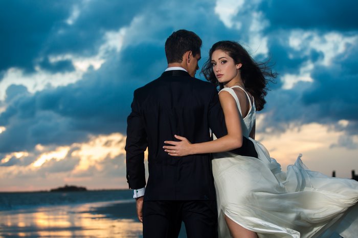 Romantic Couple Embracing on Beach at Sunset