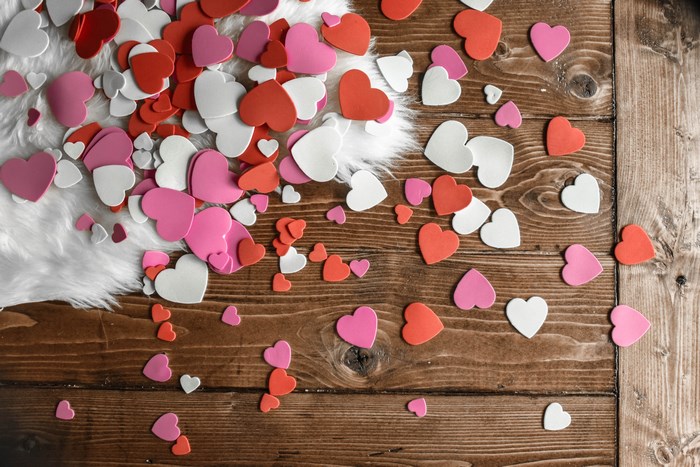 Red, Pink, and White Foam Hearts on Wooden Floor