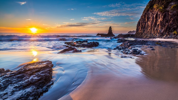 Sunrise over a rocky beach in Australia