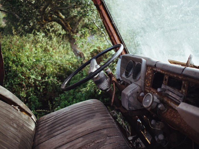 Abandoned Rusty Truck Interior with Overgrown Nature