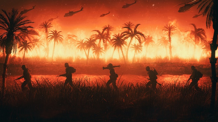 Soldiers advancing through a burning jungle with helicopters
