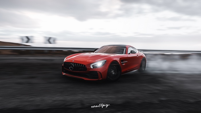 Red Mercedes-AMG GT drifting on a road