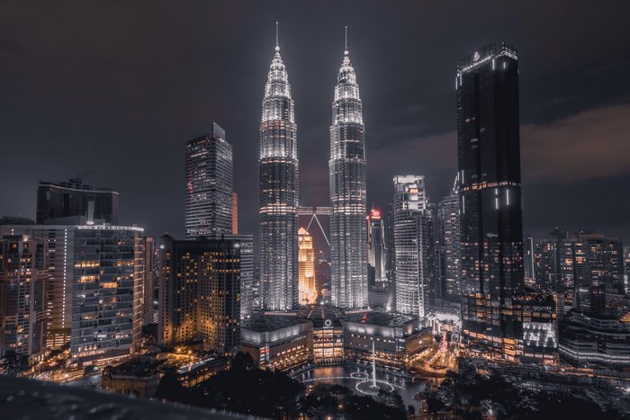 Illuminated Twin Towers Cityscape at Night 4K