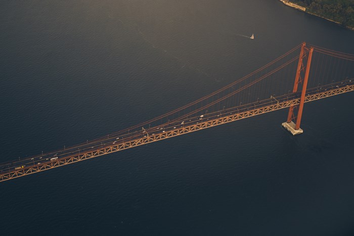 Aerial view of a suspension bridge over a river