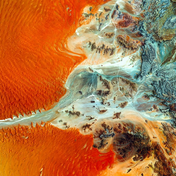 Aerial view of desert landscape in Namibia with sand dunes and mountains