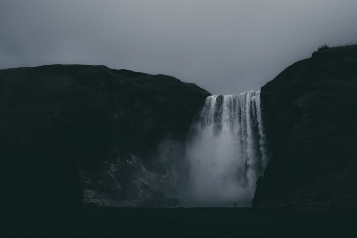 Skogafoss Waterfall in Iceland Under Overcast Skies