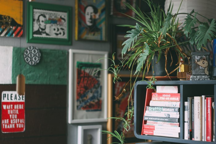 Wall art and books in a home office