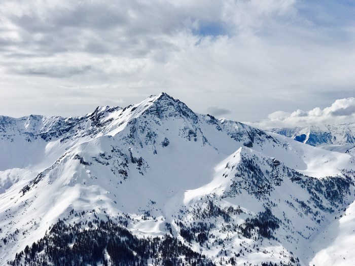 Snowy mountain range with cloudy sky in France