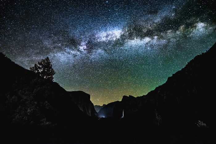 Yosemite National Park at Night with Milky Way and Waterfall