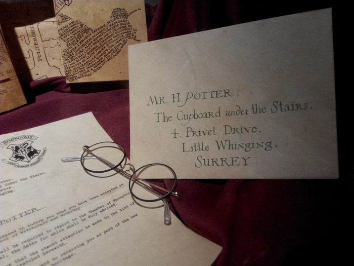 Harry Potter's Hogwarts letter and glasses