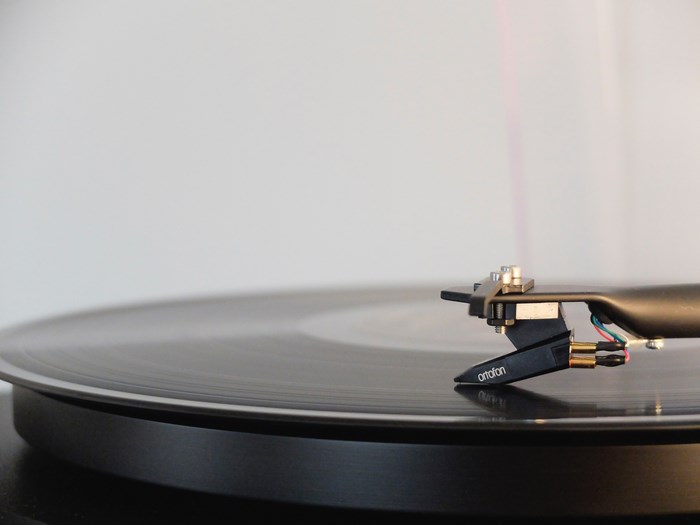 Ortofon stylus on a spinning vinyl record