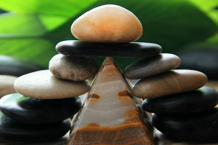 Zen stone balancing on a pyramid